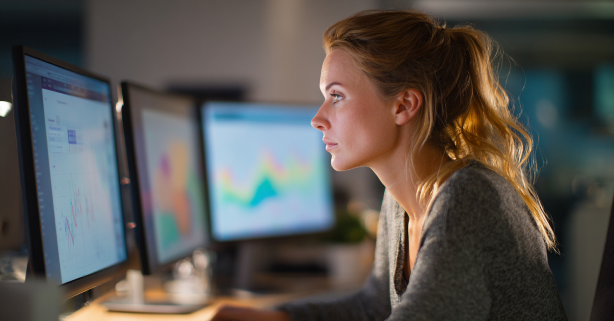 A content manager reviewing web analytics data on multiple screens, trying to understand user behavior from numbers alone.